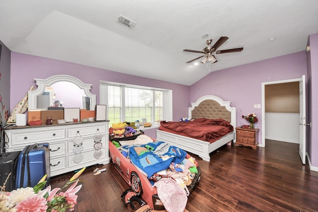 bedroom featuring vaulted ceiling, a ceiling fan, hardwood / wood-style floors, and visible vents