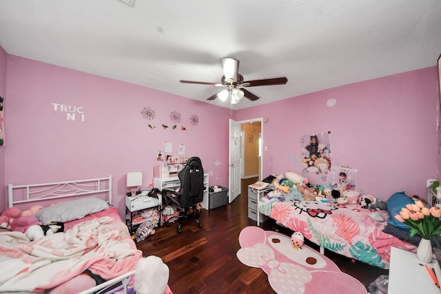 bedroom featuring wood finished floors and ceiling fan