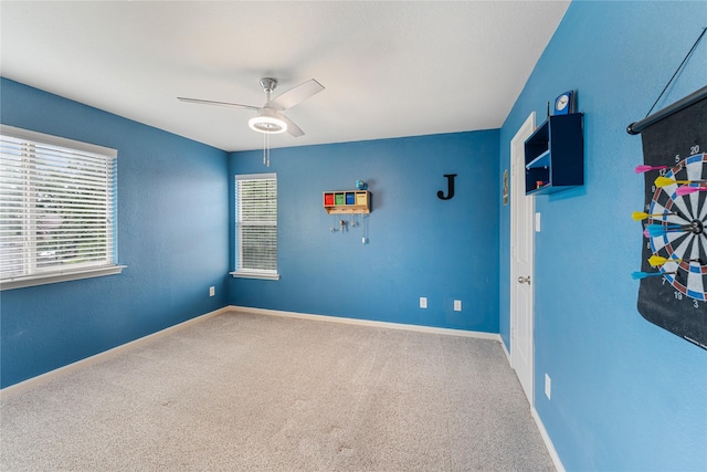 18823 Cove Mill Ln, Cypress, TX 77433 - spare room featuring a ceiling fan and carpet flooring