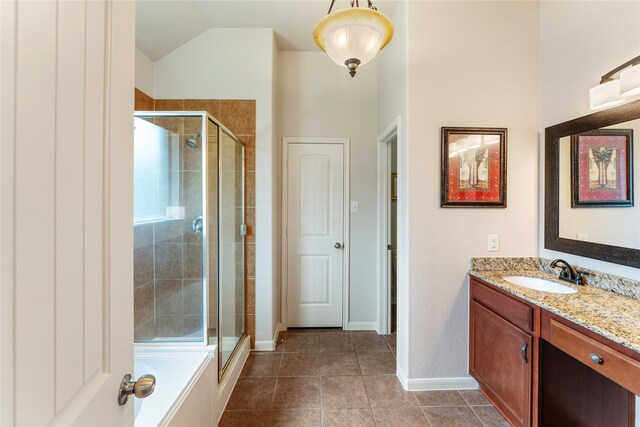 bathroom with tile patterned floors, baseboards, vanity, and a stall shower
