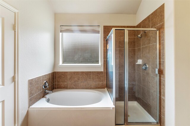 full bathroom with a garden tub and a stall shower
