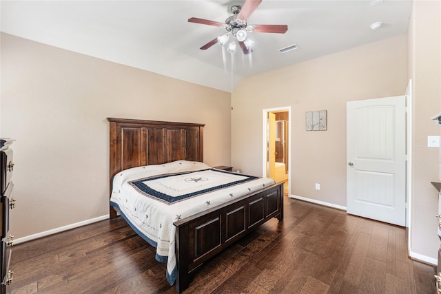 bedroom with baseboards, vaulted ceiling, visible vents, and dark wood-type flooring