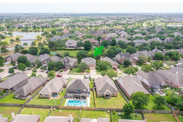 aerial view featuring a residential view and a water view