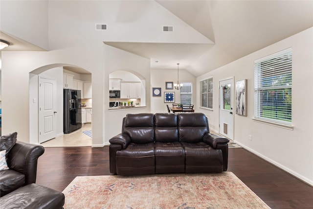 18823 Cove Mill Ln, Cypress, TX 77433 - living room featuring light wood-style floors, a chandelier, and high vaulted ceiling