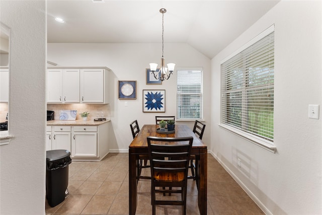 18823 Cove Mill Ln, Cypress, TX 77433 - dining space with light tile patterned floors, a chandelier, and vaulted ceiling