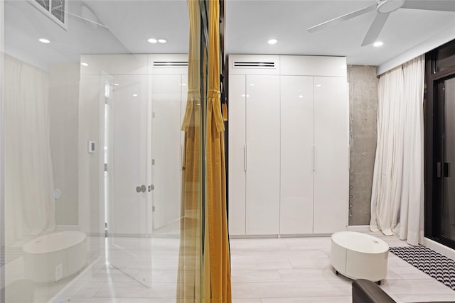 full bath featuring a shower stall, ceiling fan, visible vents, and recessed lighting