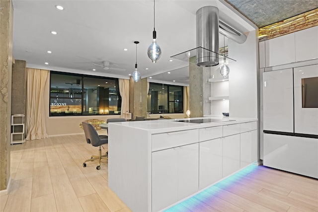 interior space featuring white cabinets, black electric cooktop, ceiling fan, and modern cabinets