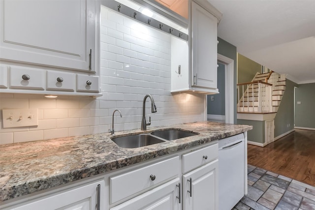 302 Hickory Ridge Dr, El Lago, TX 77586 - kitchen featuring white cabinetry, a sink, dishwasher, stone counters, and backsplash