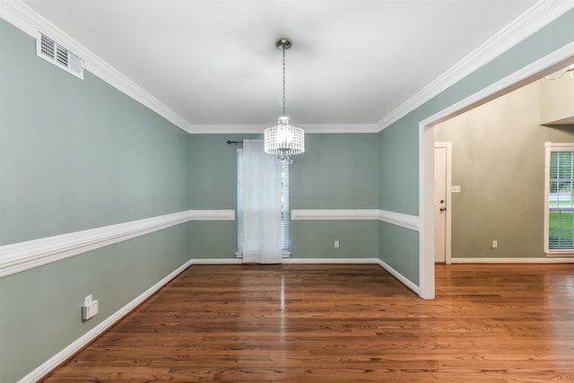 302 Hickory Ridge Dr, El Lago, TX 77586 - unfurnished dining area featuring visible vents, wood finished floors, an inviting chandelier, and crown molding
