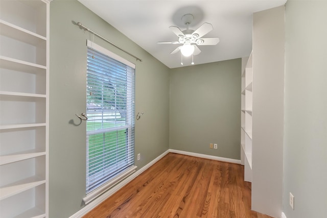 302 Hickory Ridge Dr, El Lago, TX 77586 - spare room featuring wood finished floors, a ceiling fan, and baseboards