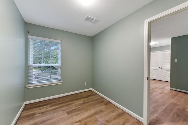302 Hickory Ridge Dr, El Lago, TX 77586 - spare room featuring baseboards, visible vents, and wood finished floors