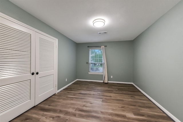 302 Hickory Ridge Dr, El Lago, TX 77586 - unfurnished bedroom with a closet, visible vents, wood finished floors, and baseboards
