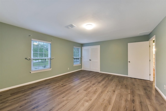 302 Hickory Ridge Dr, El Lago, TX 77586 - unfurnished bedroom featuring wood finished floors, a closet, and baseboards