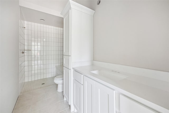 full bathroom featuring vanity, toilet, tile patterned flooring, and a walk in shower
