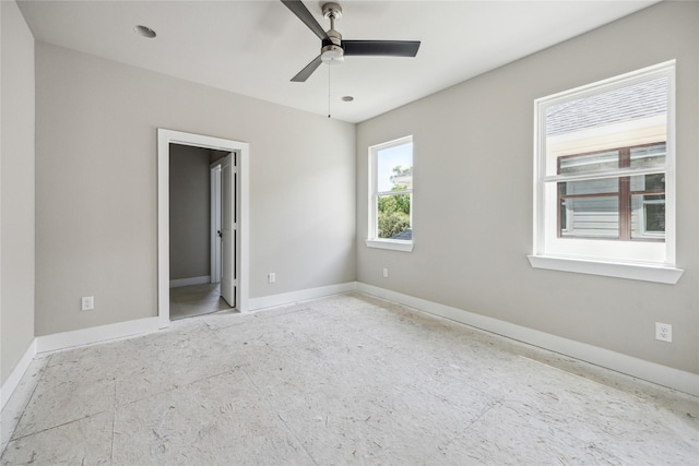 unfurnished bedroom featuring baseboards and a ceiling fan