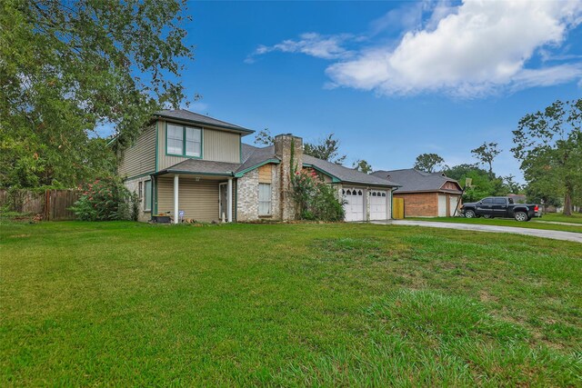 906 N Chamfer Way, Crosby, TX 77532 - traditional-style house featuring concrete driveway, a chimney, an attached garage, fence, and a front yard