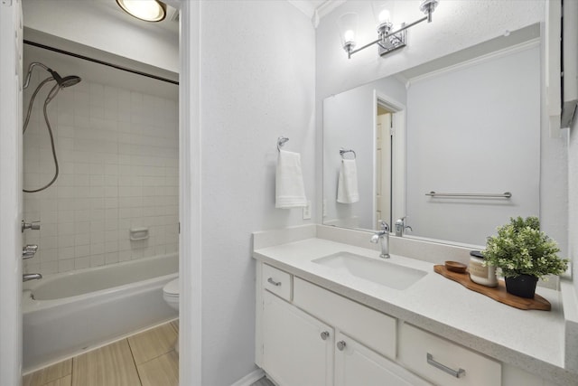 full bathroom with wood finished floors, bathing tub / shower combination, vanity, and toilet