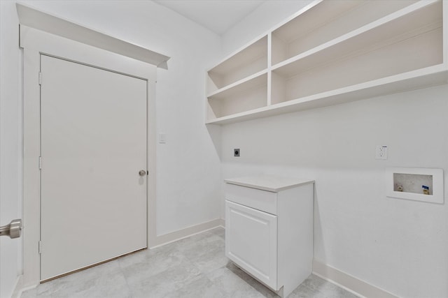 laundry area featuring baseboards, hookup for an electric dryer, washer hookup, and cabinet space