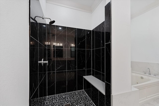 full bath with a jetted tub and tiled shower