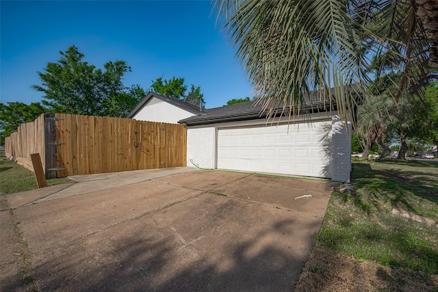 garage featuring fence