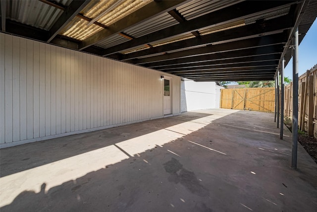 view of patio / terrace with a fenced backyard and an attached carport