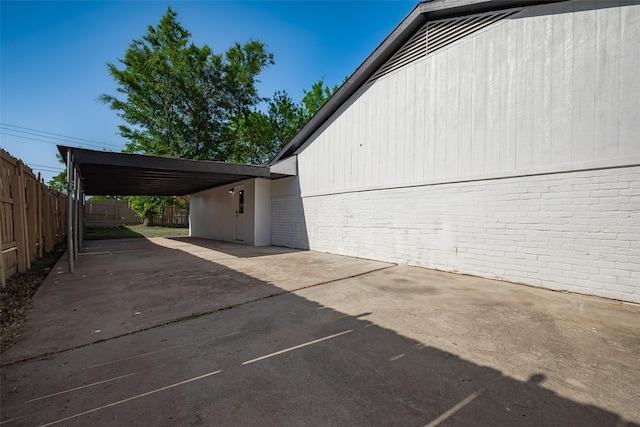 view of side of property with fence