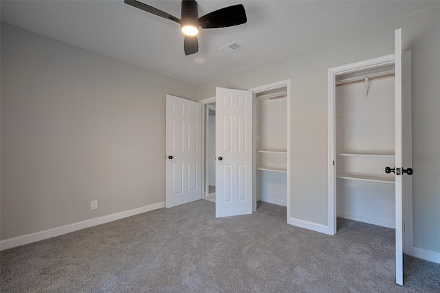 unfurnished bedroom with visible vents, baseboards, carpet flooring, and ceiling fan