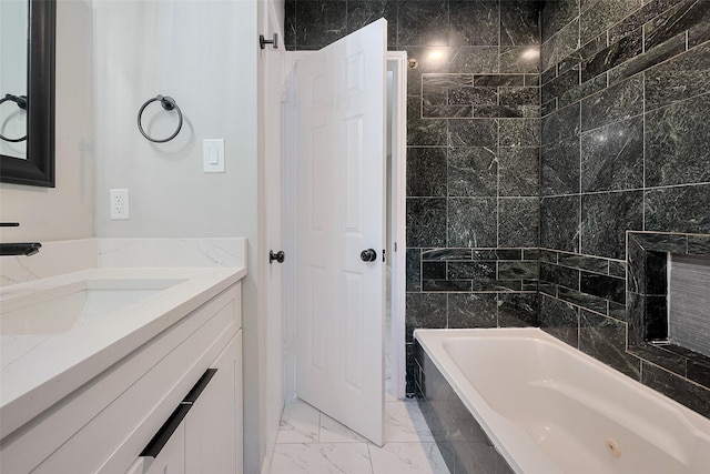 full bath with marble finish floor and vanity