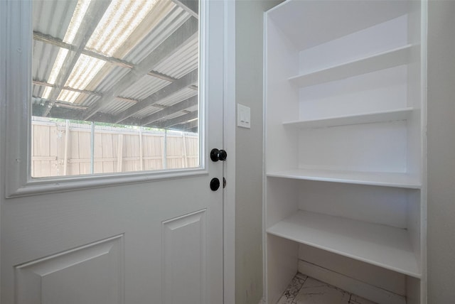 entryway with marble finish floor
