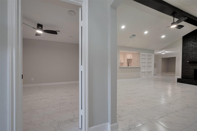 hallway with lofted ceiling, marble finish floor, visible vents, baseboards, and built in shelves