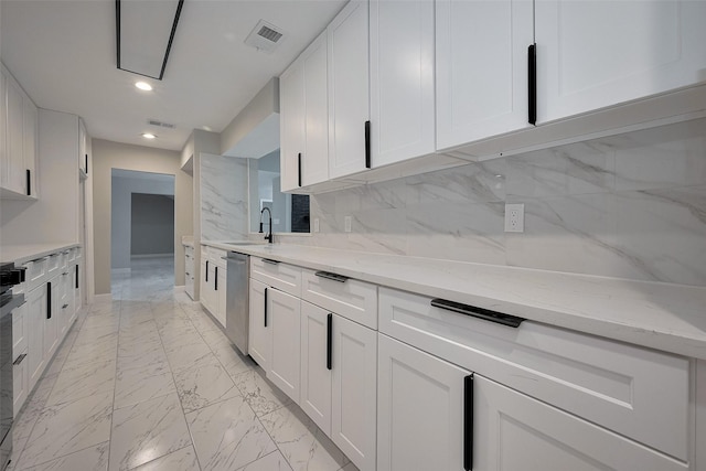 kitchen with stainless steel dishwasher, visible vents, baseboards, white cabinetry, and marble finish floor