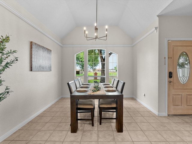 dining space featuring lofted ceiling, baseboards, an inviting chandelier, and light tile patterned flooring
