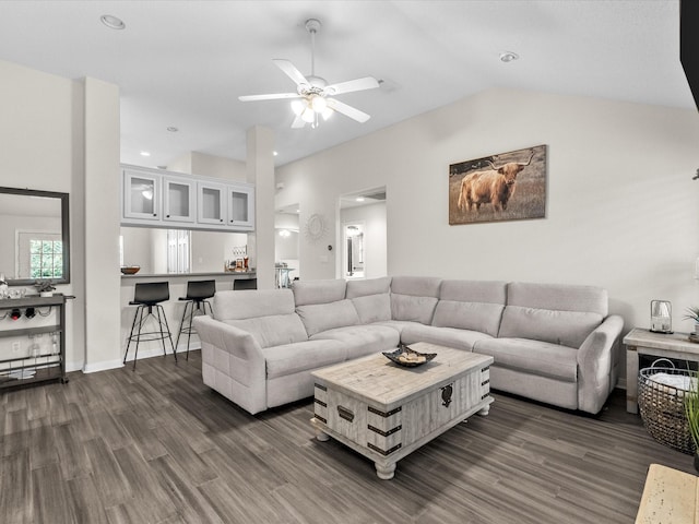 living area featuring lofted ceiling, a ceiling fan, recessed lighting, and dark wood-style flooring