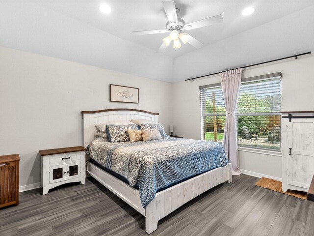 bedroom with baseboards, wood finished floors, and recessed lighting