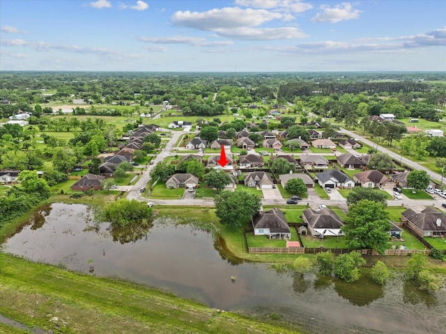 drone / aerial view with a residential view and a water view