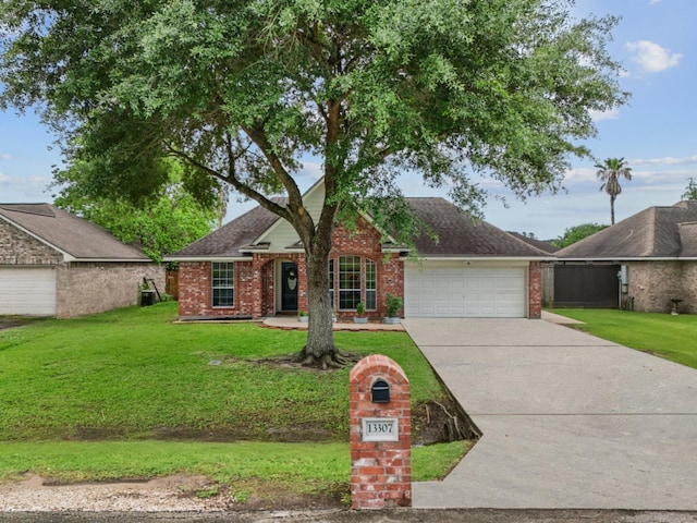 view of front of house with a garage, brick siding, a front yard, and concrete driveway