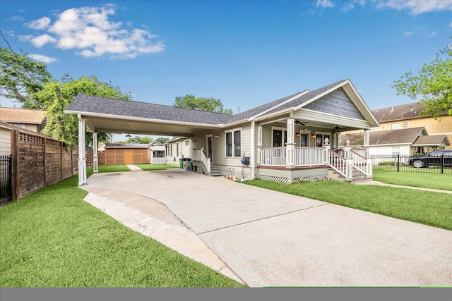 view of front of house with a porch, ceiling fan, concrete driveway, and a front yard