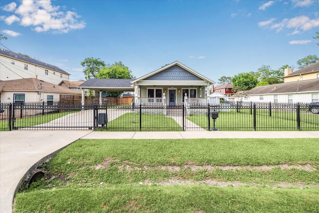 bungalow-style home featuring a porch, a fenced front yard, a front yard, a gate, and concrete driveway