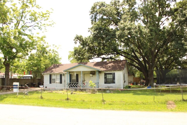 2014 Kowis St, Houston, TX 77093 - view of front of house featuring a fenced front yard, a trampoline, and a front lawn