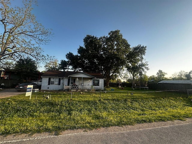 2014 Kowis St, Houston, TX 77093 - view of front of house featuring a fenced front yard, a front yard, and a trampoline