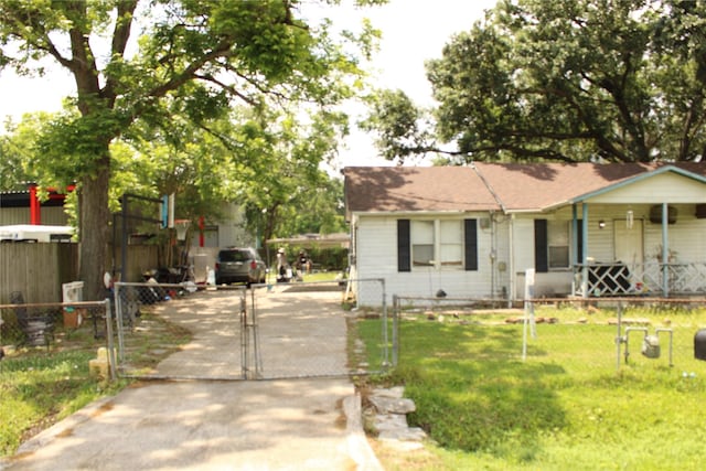 2014 Kowis St, Houston, TX 77093 - view of front of house featuring covered porch, a front lawn, fence, and a gate
