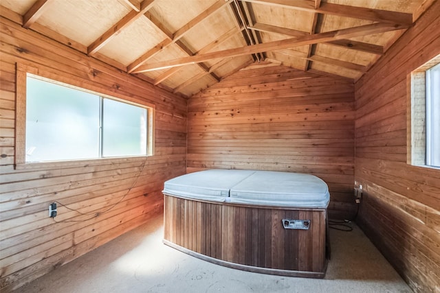 misc room with wooden walls, vaulted ceiling, and a sauna