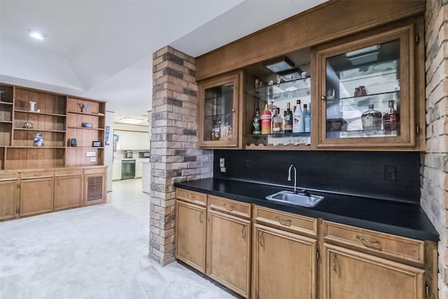 bar with lofted ceiling, light carpet, indoor wet bar, and a sink