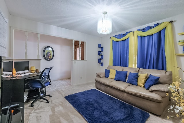 carpeted office space featuring a textured ceiling and a chandelier