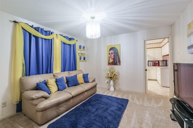 living area featuring a notable chandelier and light colored carpet