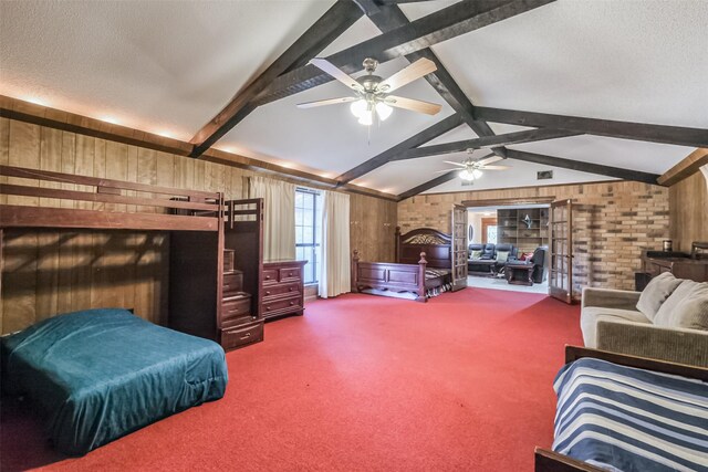 carpeted bedroom with wooden walls, a textured ceiling, and vaulted ceiling with beams