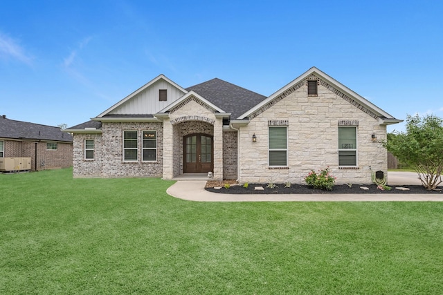 view of front of property with board and batten siding, stone siding, french doors, and a front yard