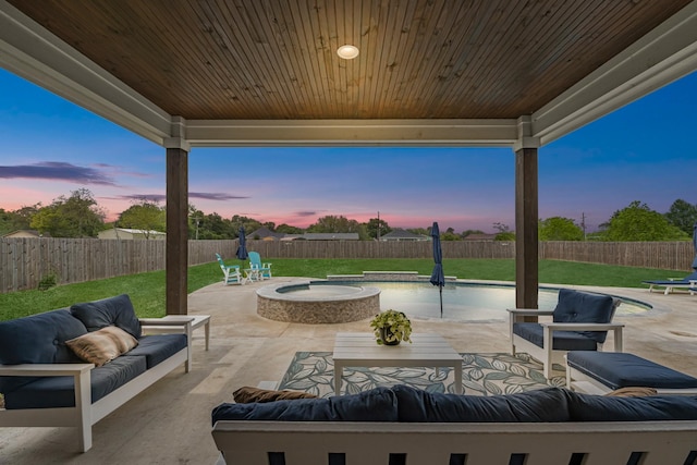 view of patio featuring an outdoor hangout area, a fenced in pool, and a fenced backyard