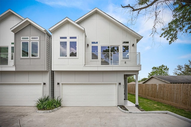 861 Prosper St, Houston, TX 77088 - exterior space featuring an attached garage, fence, a balcony, and concrete driveway