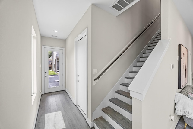 861 Prosper St, Houston, TX 77088 - entryway featuring recessed lighting, light wood-type flooring, visible vents, and stairway